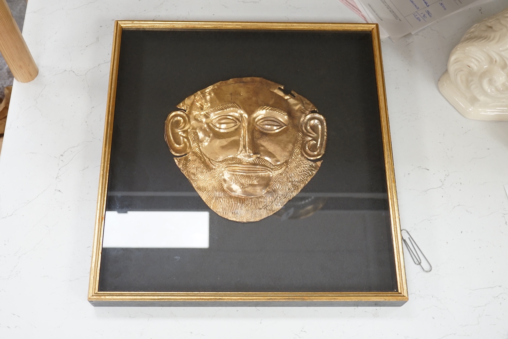 A museum type replica of an Agamemnon mask, copied from the gold mask of the king from the fifth Royal tomb on the Acropolis of Mycenae, 16th century B.C., made in Greece. Condition - good.